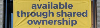 Banner advertising new apartments "available through shared ownership"