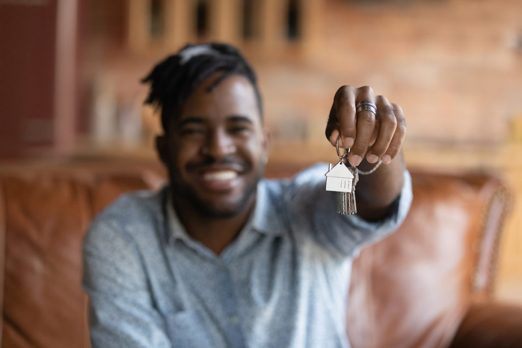 Image for shared ownership reforms feature - young man with house keys