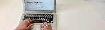 Laptop displaying HMRC shared ownership SDLT webpage