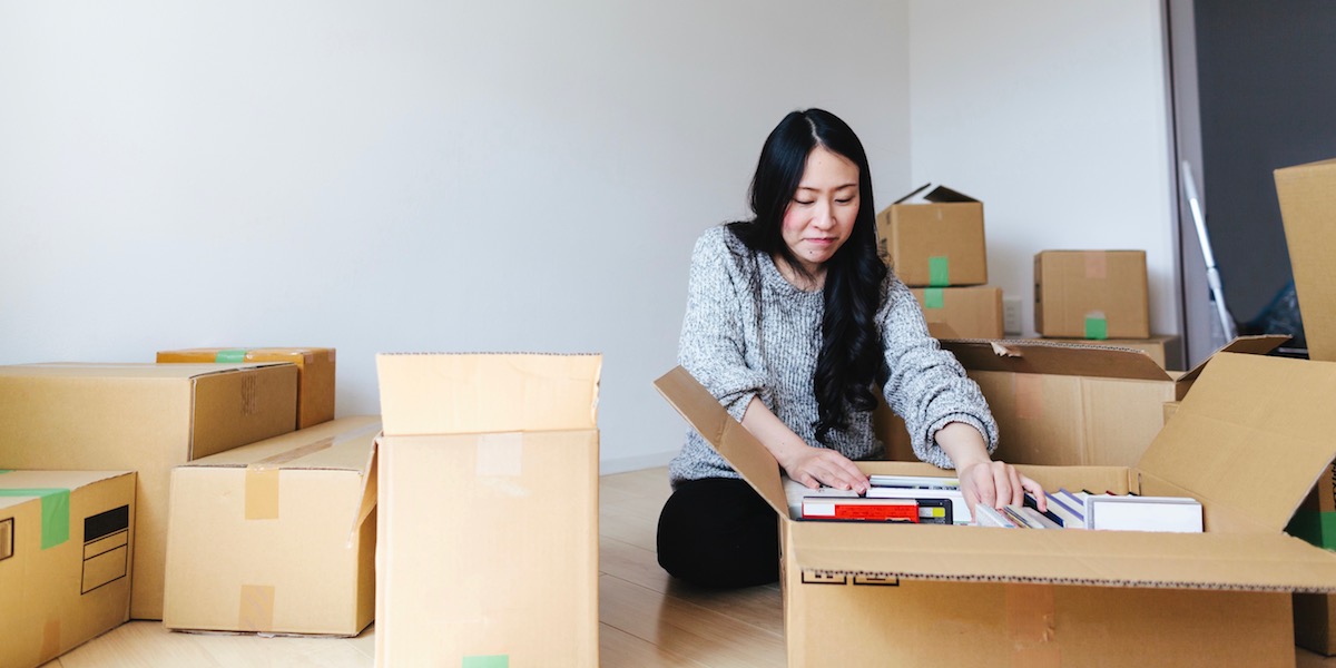 Young Japanese woman unpacking
