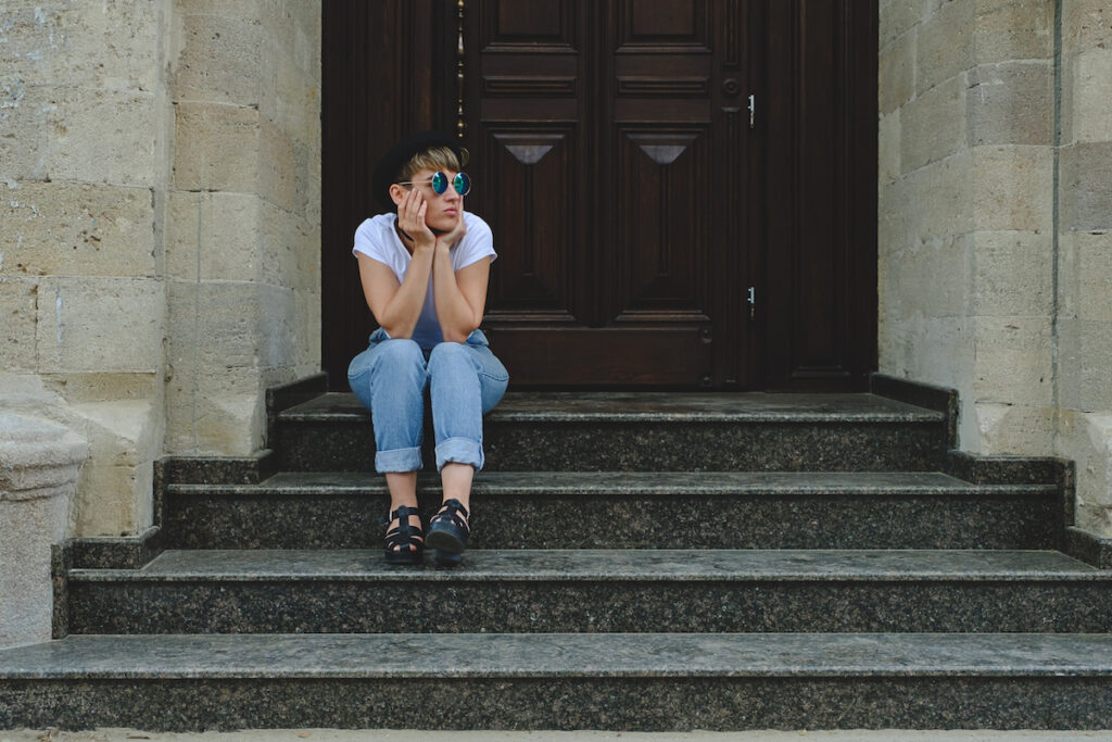 Young woman sitting on steps