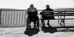 Elderly couple sitting by the sea