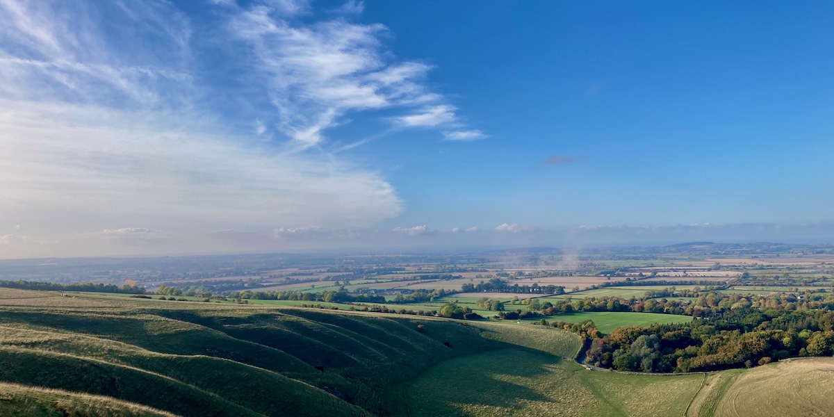 Panoramic view of landscape with blue sky