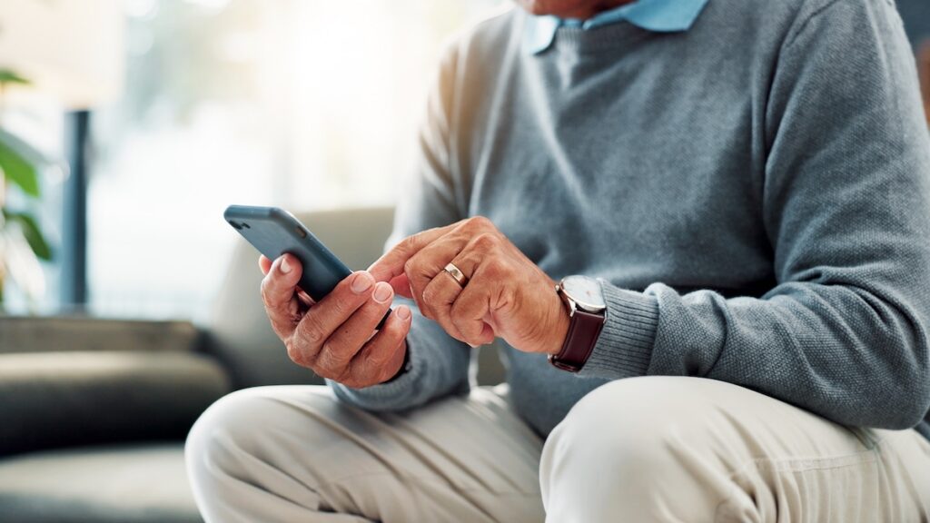 Man using keypad on phone