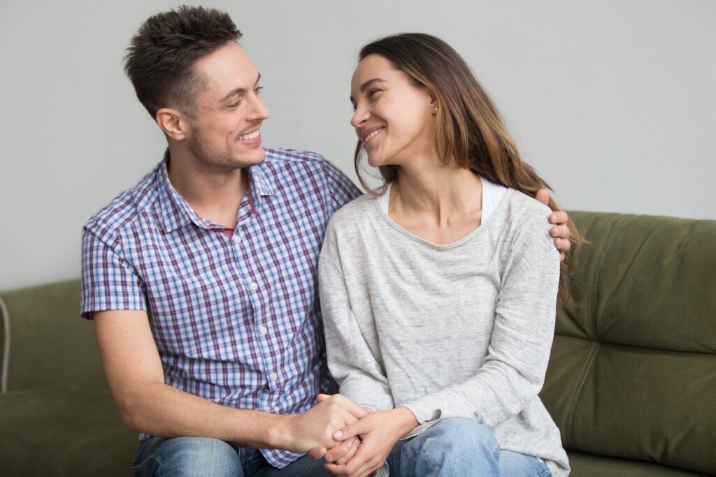 Young couple looking into each others eyes and smiling
